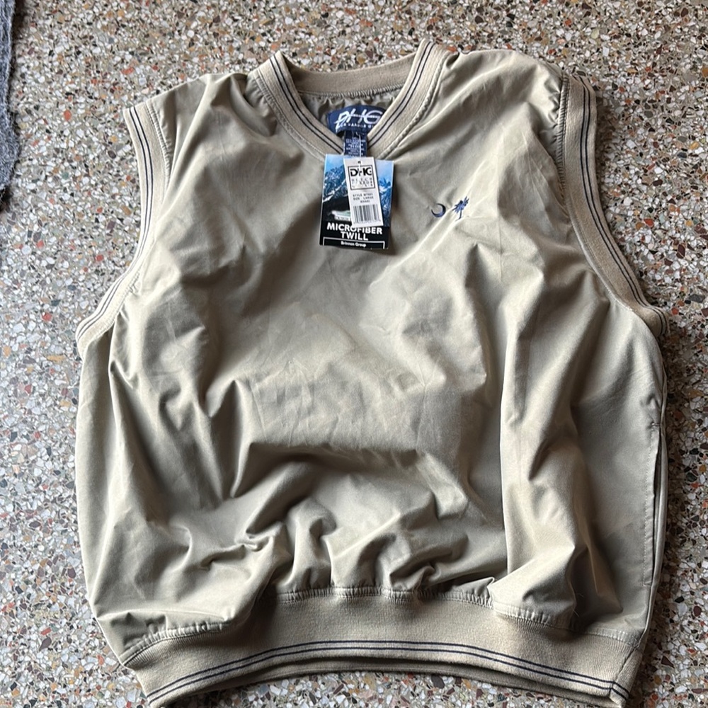 NWT Men’s khaki vest size L with the palmetto tree & moon on the left chest.
